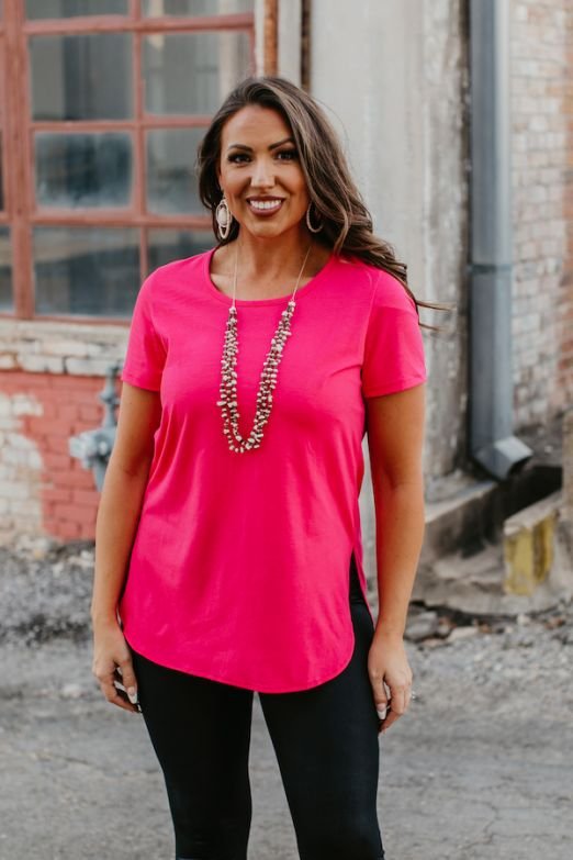 ESSENTIAL NEON PINK SHORT SLEEVE TOP WITH CURVED HEM RELAXED FIT SCOOP NECK WITH SIDE SLIT