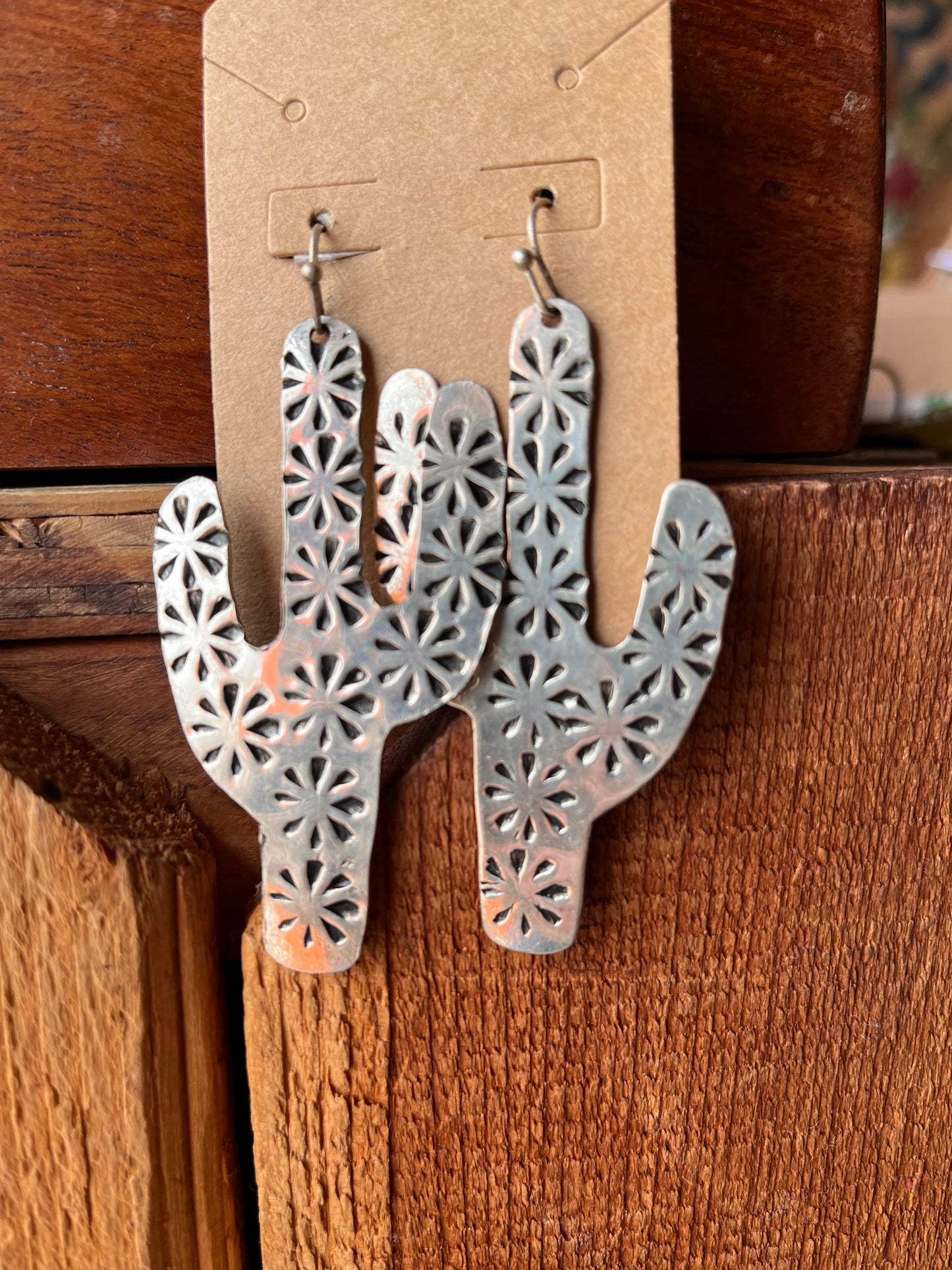 Silver cactus earrings with starburst